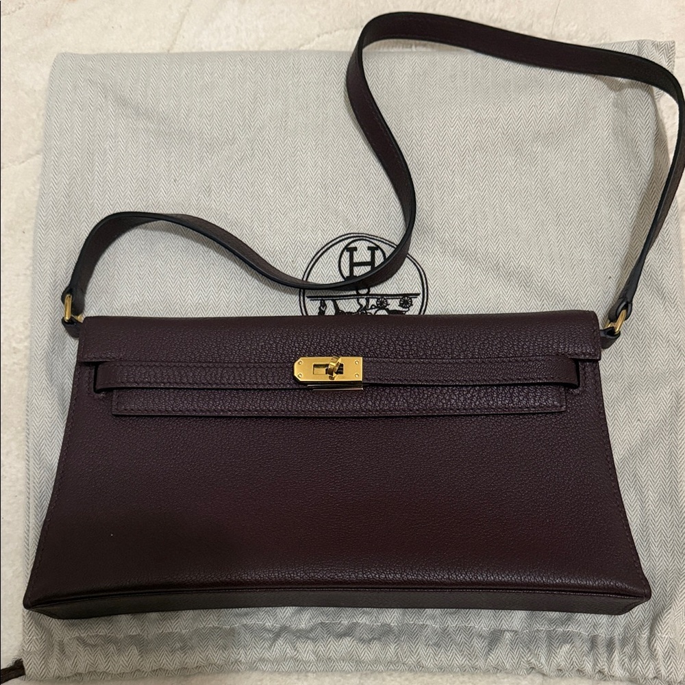 Hermes Dark Purple Leather Clutch with Gold Accents